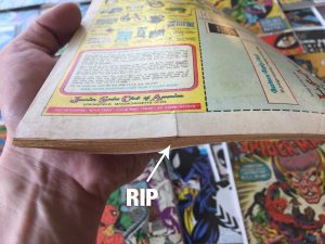 Assess condition of comic book to determine value